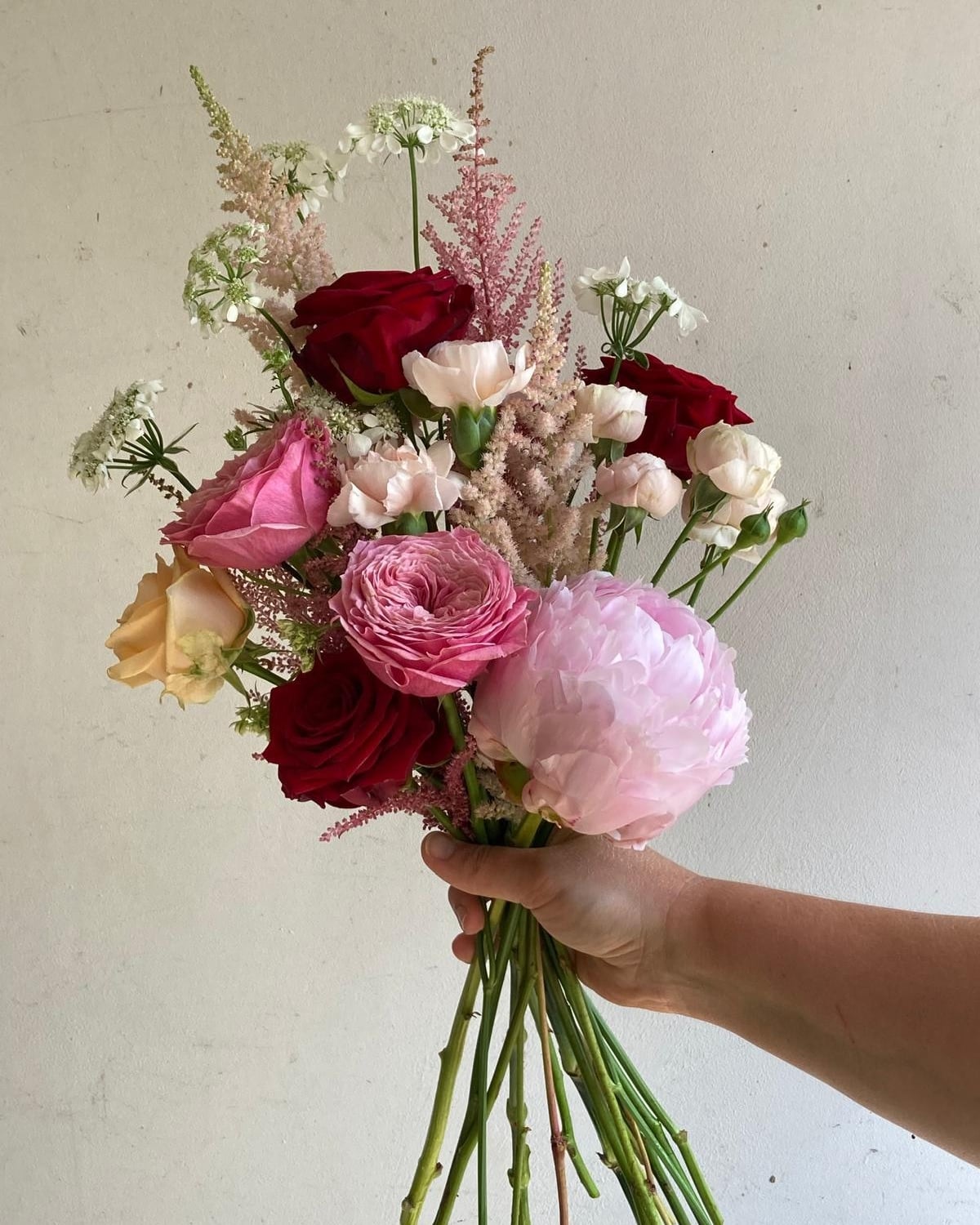 A beautiful hand-tied bridal bouquet by Petal & Page